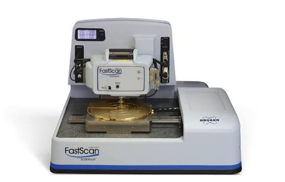 A supplied AFM instrument photograph illustrating nanoscale surface characterization.