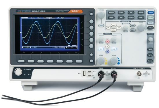 A supplied digital oscilloscope photograph illustrating waveform observation and electronic measurements.